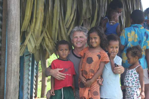 Adrian Zidaritz, with a local family in Fiji